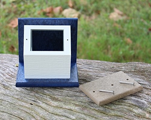 Birdhouse mounting kit on a wooden surface with screws.