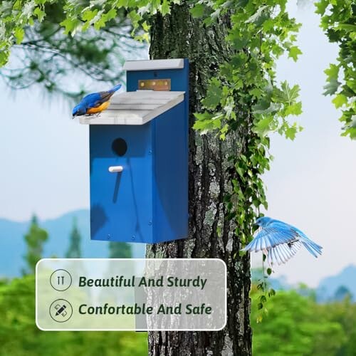 Blue birdhouse on tree with birds