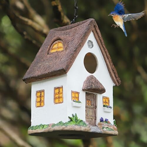 Decorative birdhouse with a bluebird flying nearby