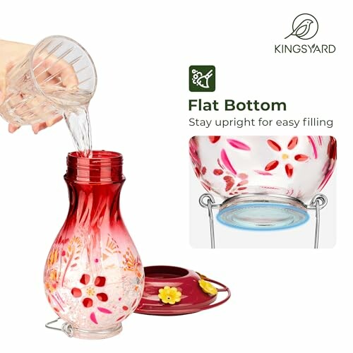 Hand pouring water into a decorative glass flower vase with flat bottom feature.