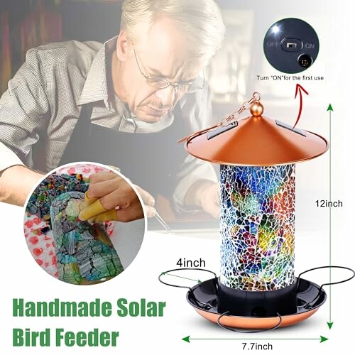 Handmade solar bird feeder with mosaic design and copper top.