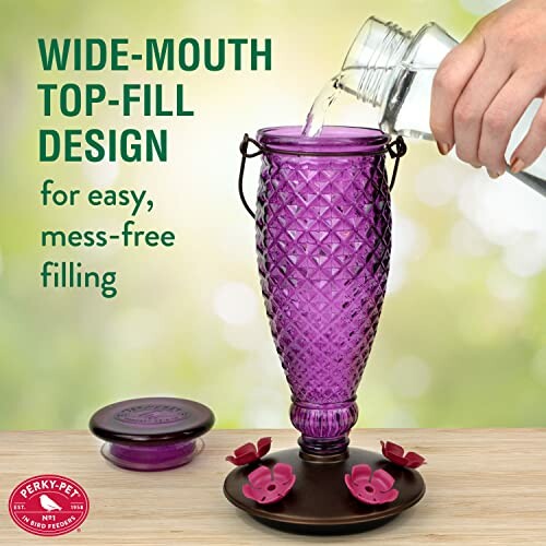 Purple glass hummingbird feeder with wide-mouth top-fill design.