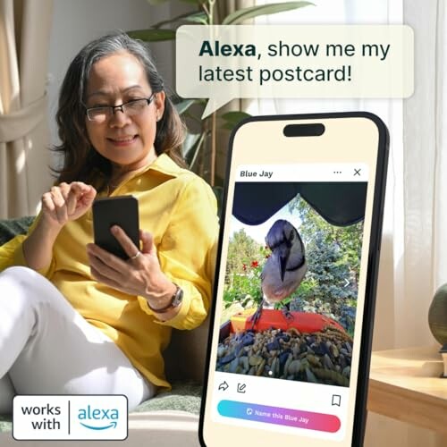 Woman using Alexa to view a bird photo on her phone.