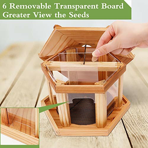 Wooden bird feeder with removable transparent panels for better seed visibility.