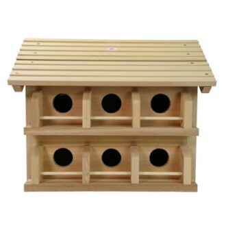 Wooden birdhouse with multiple compartments.